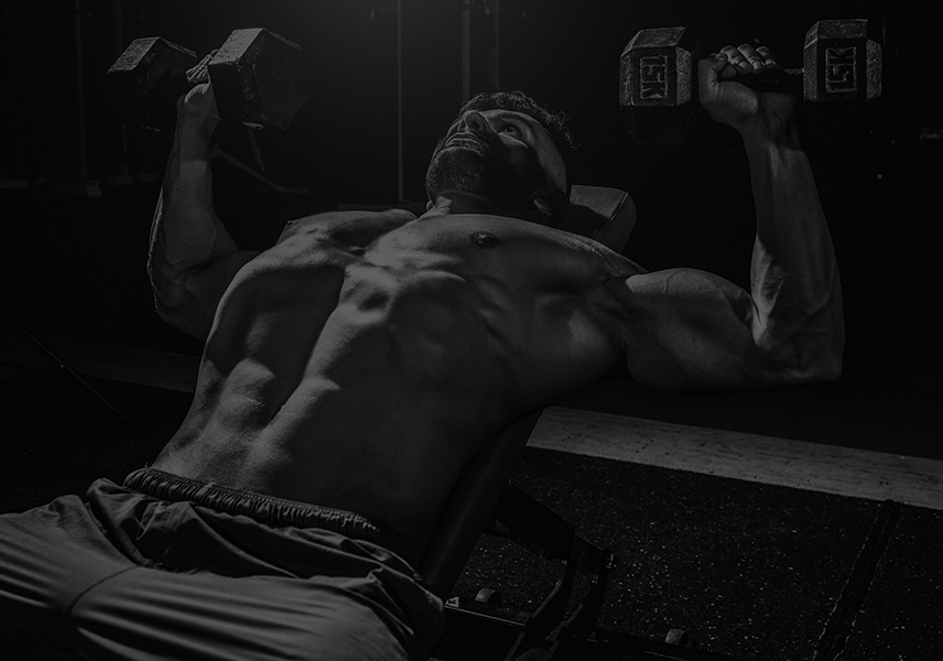 man performing chest press with dumbbells for upper body strength training